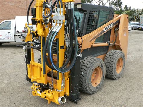 drill for skid steer|skid steer drilling attachment.